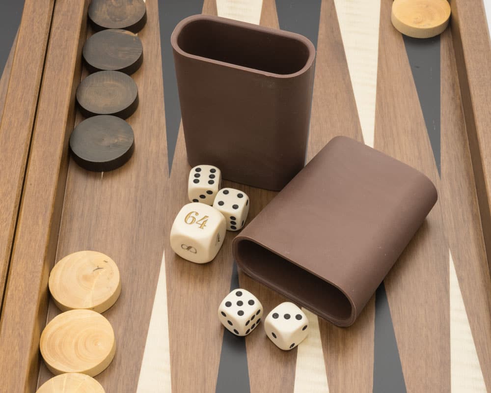 Dal Negro Walnut Deluxe Backgammon Set with dice and counters on geometric walnut wood board.