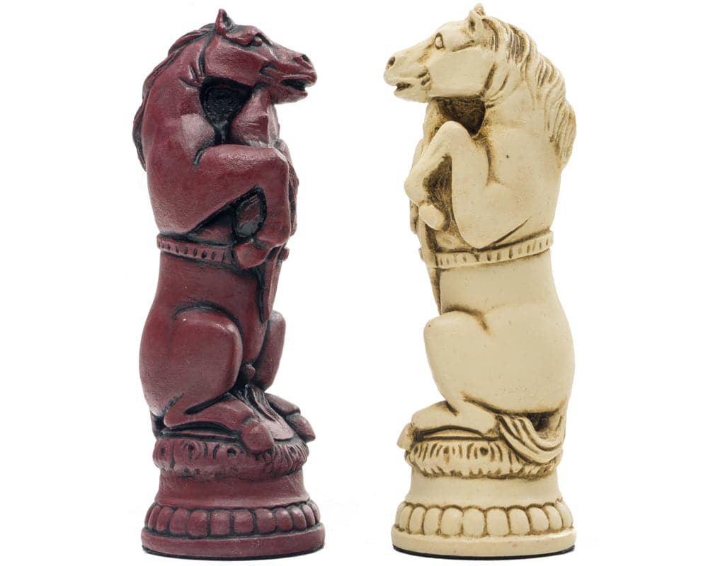 Hand crafted Reynard the Fox Cardinal chess knights in red and white, made in the UK from solid crushed stone resin, showcasing intricate details.