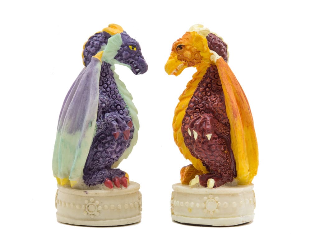 Purple and orange hand-painted medieval dragon chess pieces from Italfama on a white background, beautifully crafted in Italy.