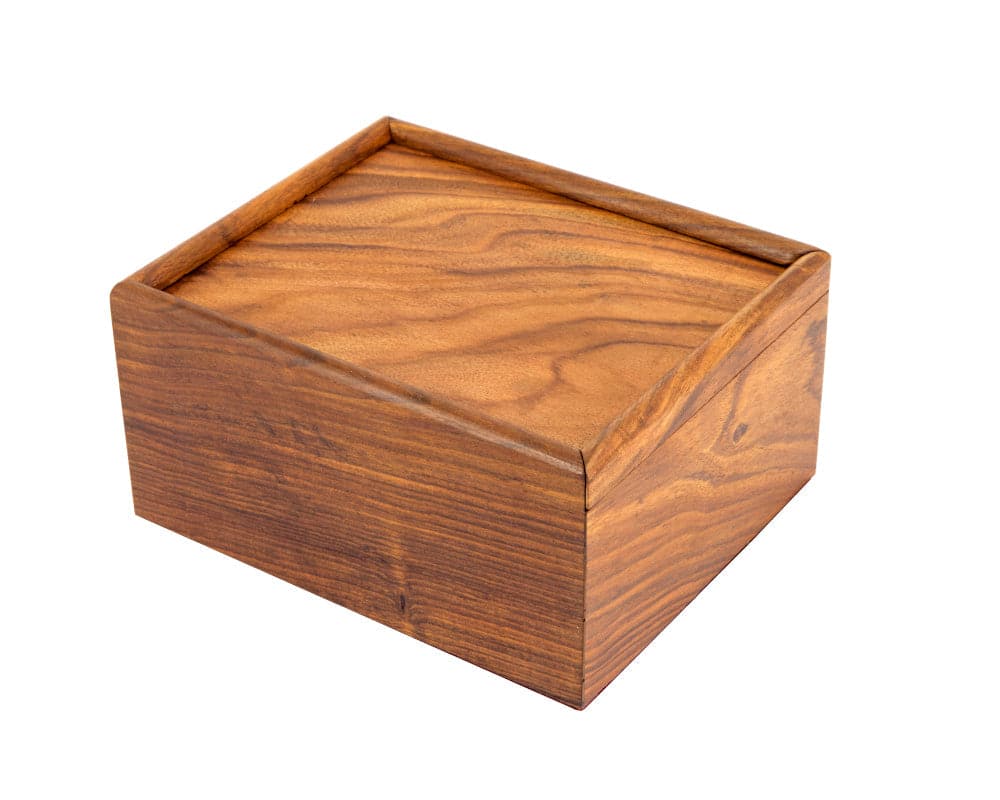 Solid wooden chess piece case with sliding lid made of luxurious exotic hardwood, showcasing its deep grain and sturdy construction.