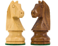 Sheesham and boxwood Down Head Knight chess pieces on white background.