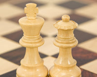 French Knight Series Ebonised Staunton Chess Pieces on chessboard, 3.25 inch king, classic Staunton design, expertly turned boxwood chessmen
