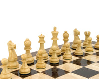 Ebonised boxwood chess pieces from Frankfurt Series on chessboard.