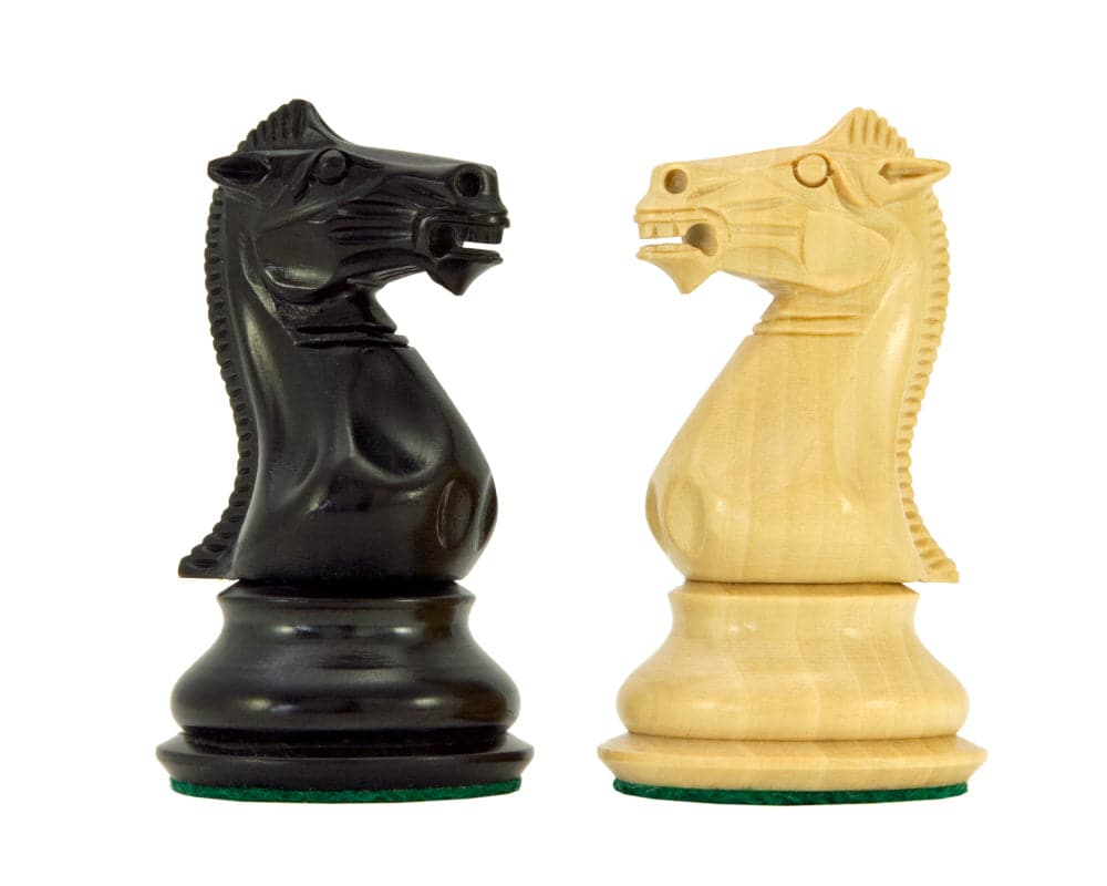 Black and white knight chess pieces from the Sandringham Series Ebony Staunton Chess Pieces set, crafted from anjan wood.