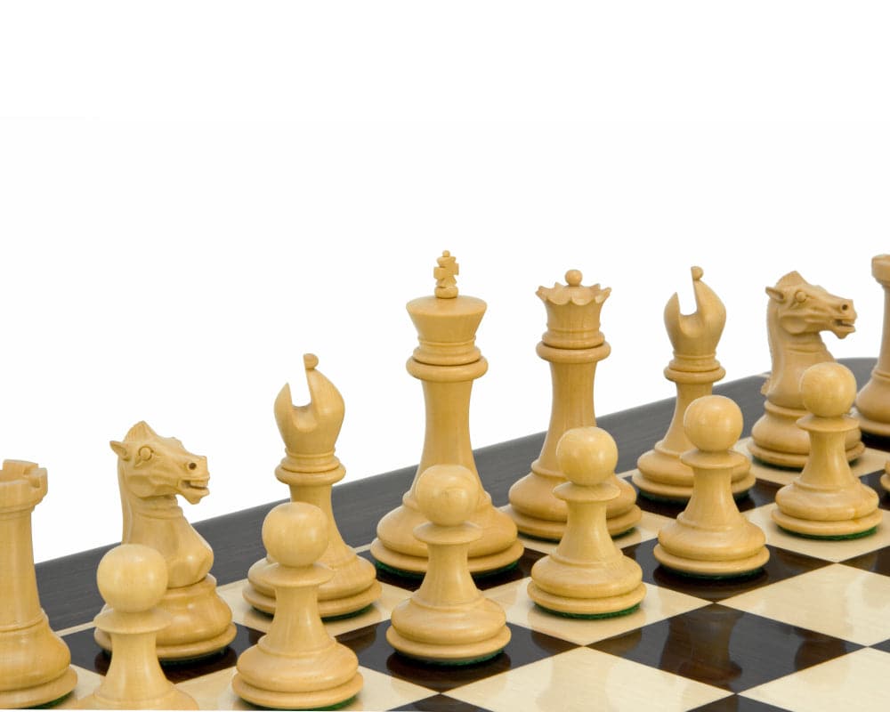 Ebonised boxwood chess pieces from the Sovereign Series on a chessboard, featuring classic Staunton design.