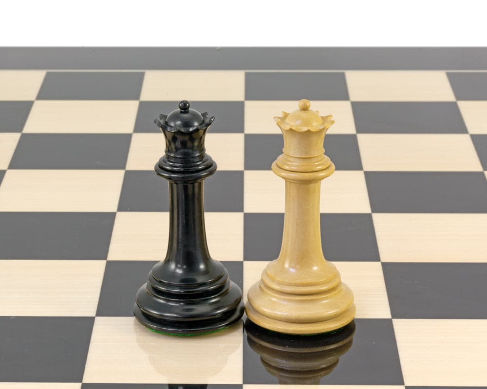 Ebony and boxwood Parthenon Series 4.5-inch chess king pieces on a checkered board, showcasing expert craftsmanship and perfect balance.