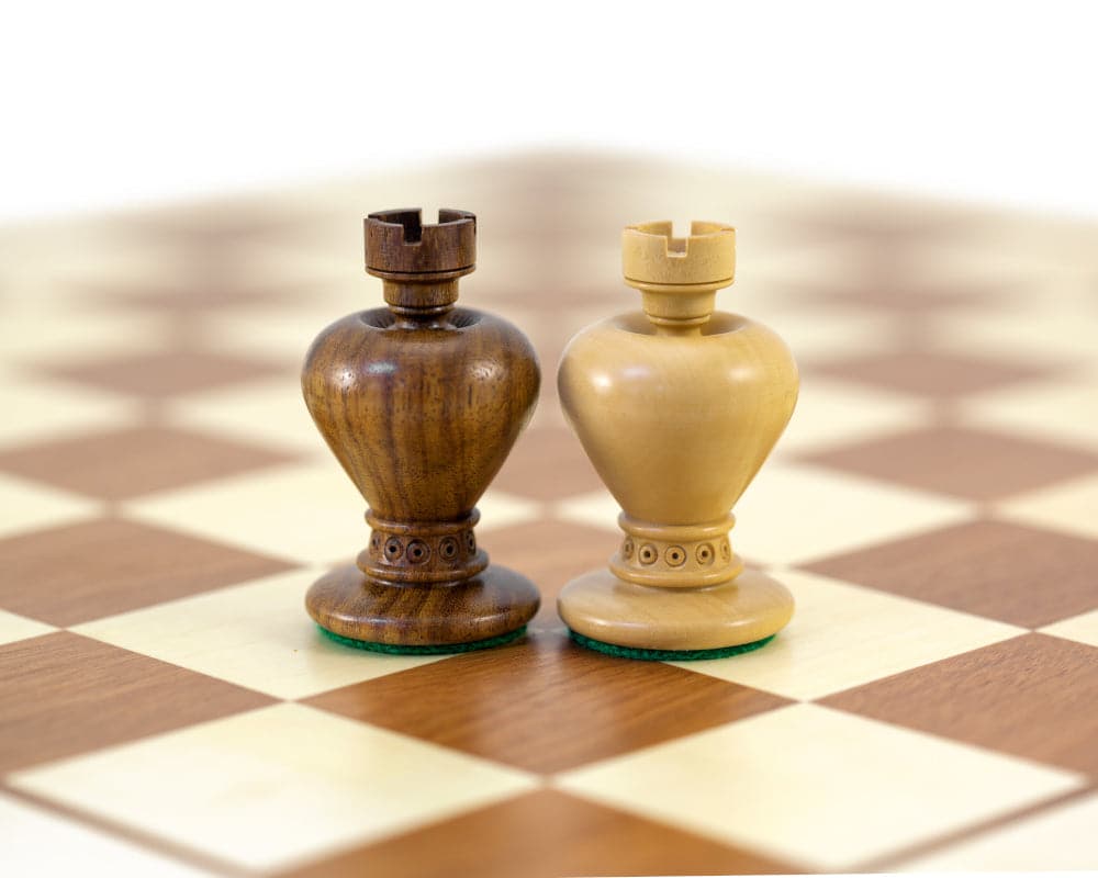 Golden rosewood and boxwood Apple Series Chessmen on chessboard