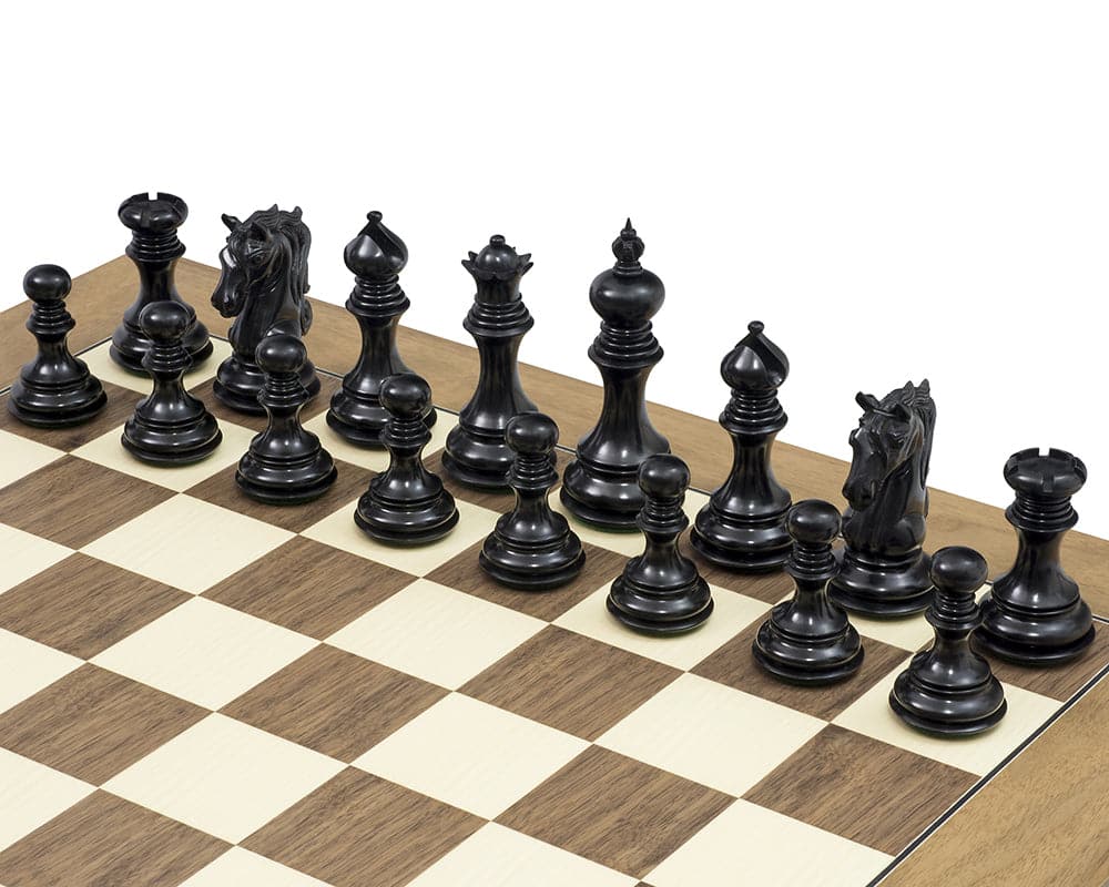 The Cavalry Series Chessmen Ebony 4.5 inch Staunton design chess pieces on a chessboard.