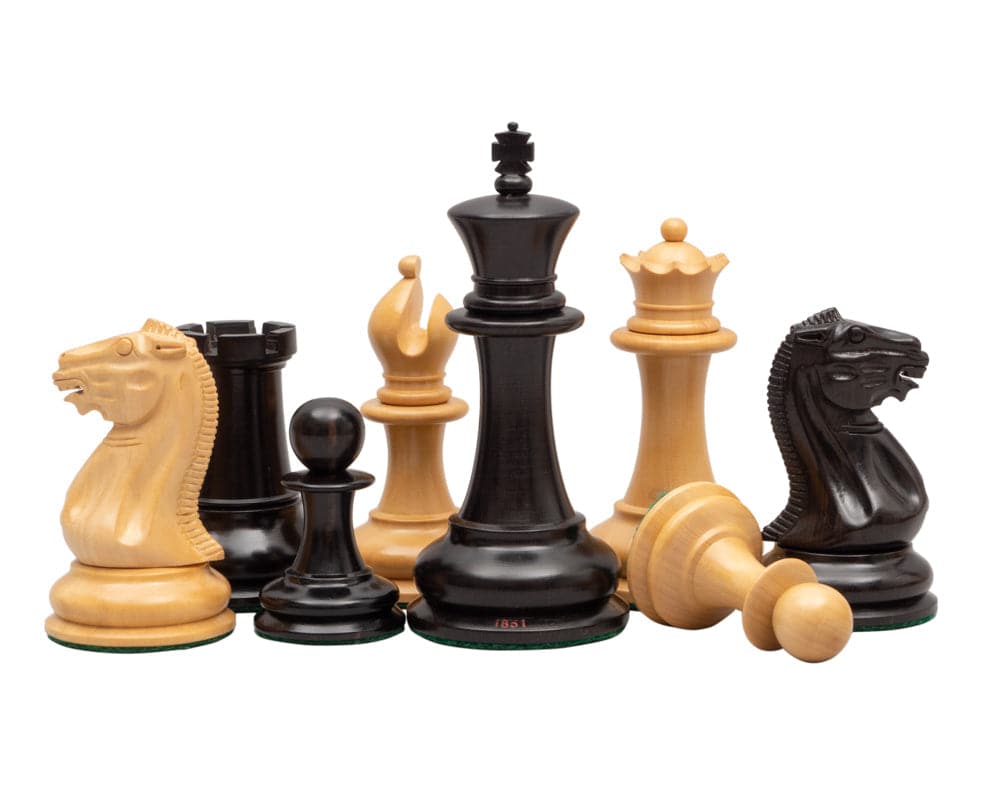 1851 Reproduction Staunton Ebony Chessmen 4.4 inch set with handcrafted ebony and boxwood pieces, featuring detailed knights and additional queens