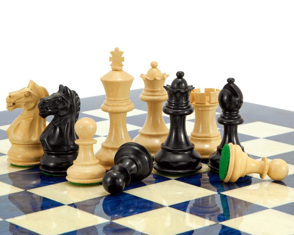 Handcrafted ebony and boxwood chessmen on Italian blue-stained erable chess board with classic Staunton design.