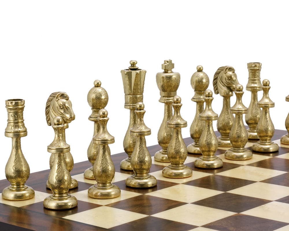 Maghreb Brass and Walnut Traditional Chess Set featuring intricately carved brass pieces on a walnut and maple veneer chessboard.