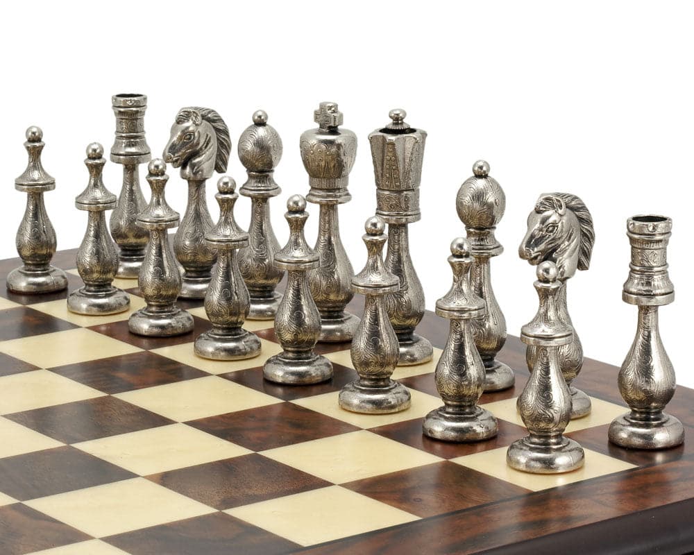 Intricate silver Maghreb chess pieces set on a Walnut and Maple chessboard for Traditional Chess Set