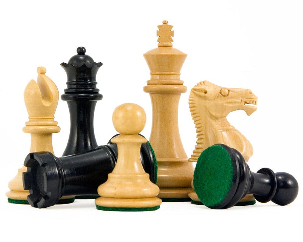 Handcrafted Staunton chess pieces on their side, showcasing the expert design and high-quality finish.