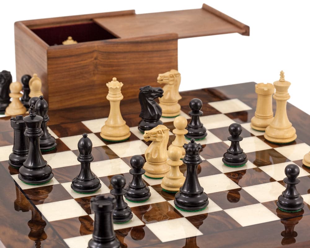 Luxury Highclere Ebony and Walnut chess set with weighted, boxwood pieces on a high-quality mahogany and birch board.