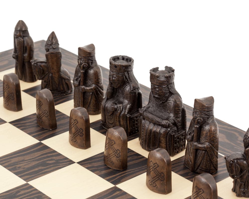 The Isle of Lewis Tiger Ebony Chess Set featuring authentic reproduction chess pieces on a tiger ebony and maple chess board