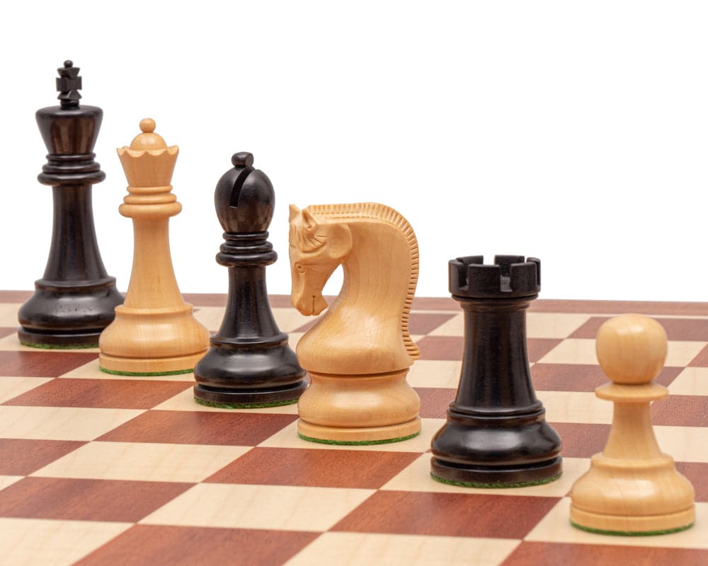 The Leningrad Mahogany Chess Set showcasing intricately detailed pieces, including a 2.8-inch king, crafted by Italian artisans on a checkered board.