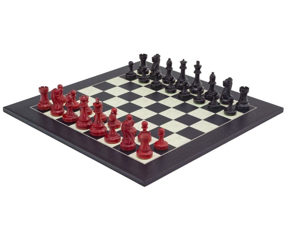 Red and black broadbase chess set on black and maple board, featuring classic Staunton design and 3.75 inch king, from Regency Chess Company.