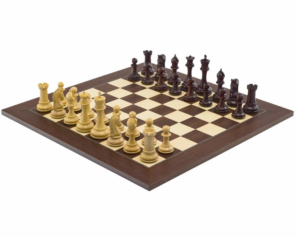 The Eminence Rosewood Palisander Deluxe chess set with elegantly carved pieces ready for play on a wooden chessboard.