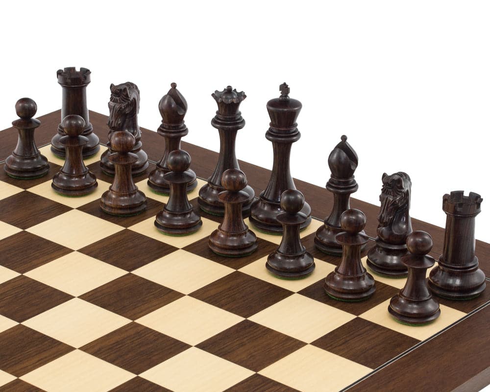 The Eminence Rosewood Palisander Deluxe chess set with detailed hand carved pieces on a wooden chessboard