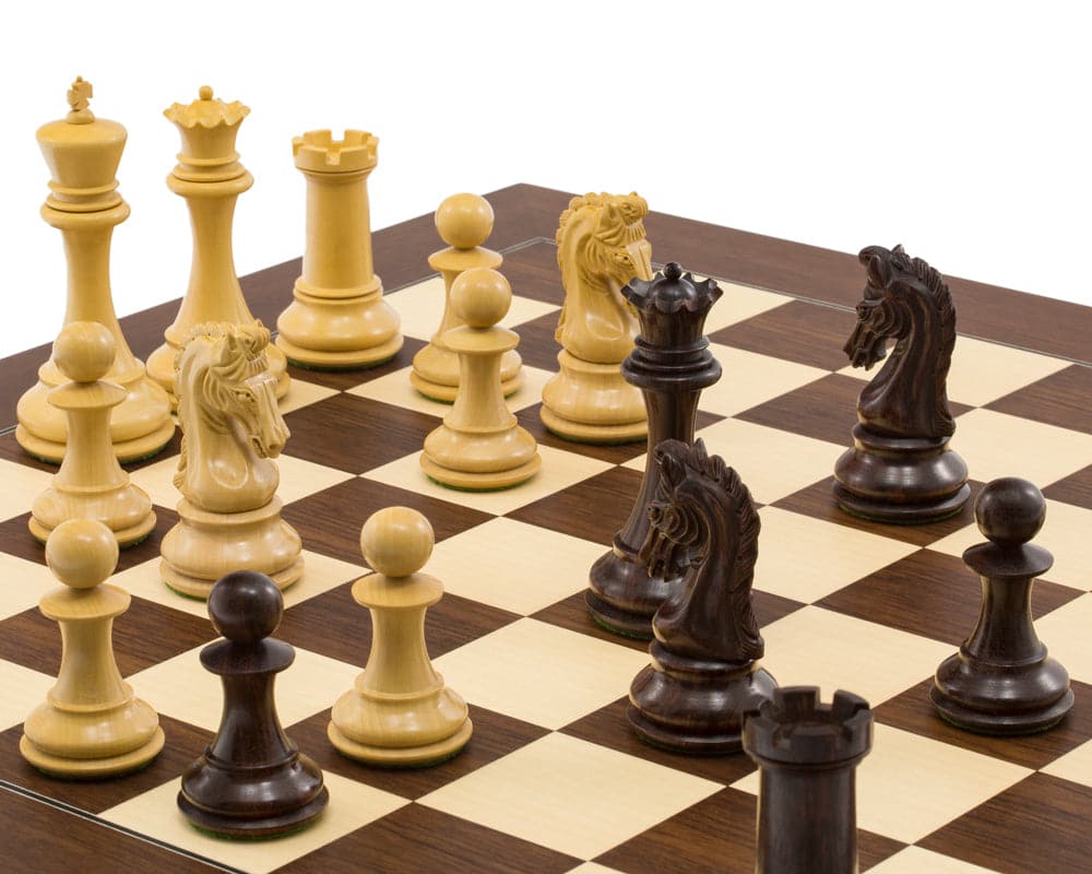 The Eminence Rosewood Palisander Deluxe Chess Set with intricately carved pieces on a chessboard