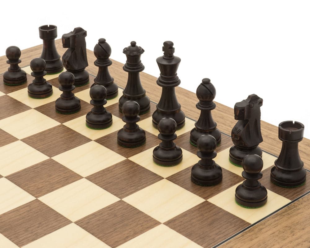 Antiqued British Staunton chess pieces on maple and walnut board, showcasing classic and contemporary design.