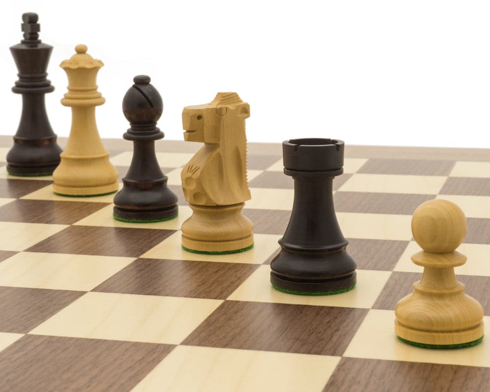 Antiqued British Staunton chess pieces on a Maple and Walnut board in a stylish traditional chess set