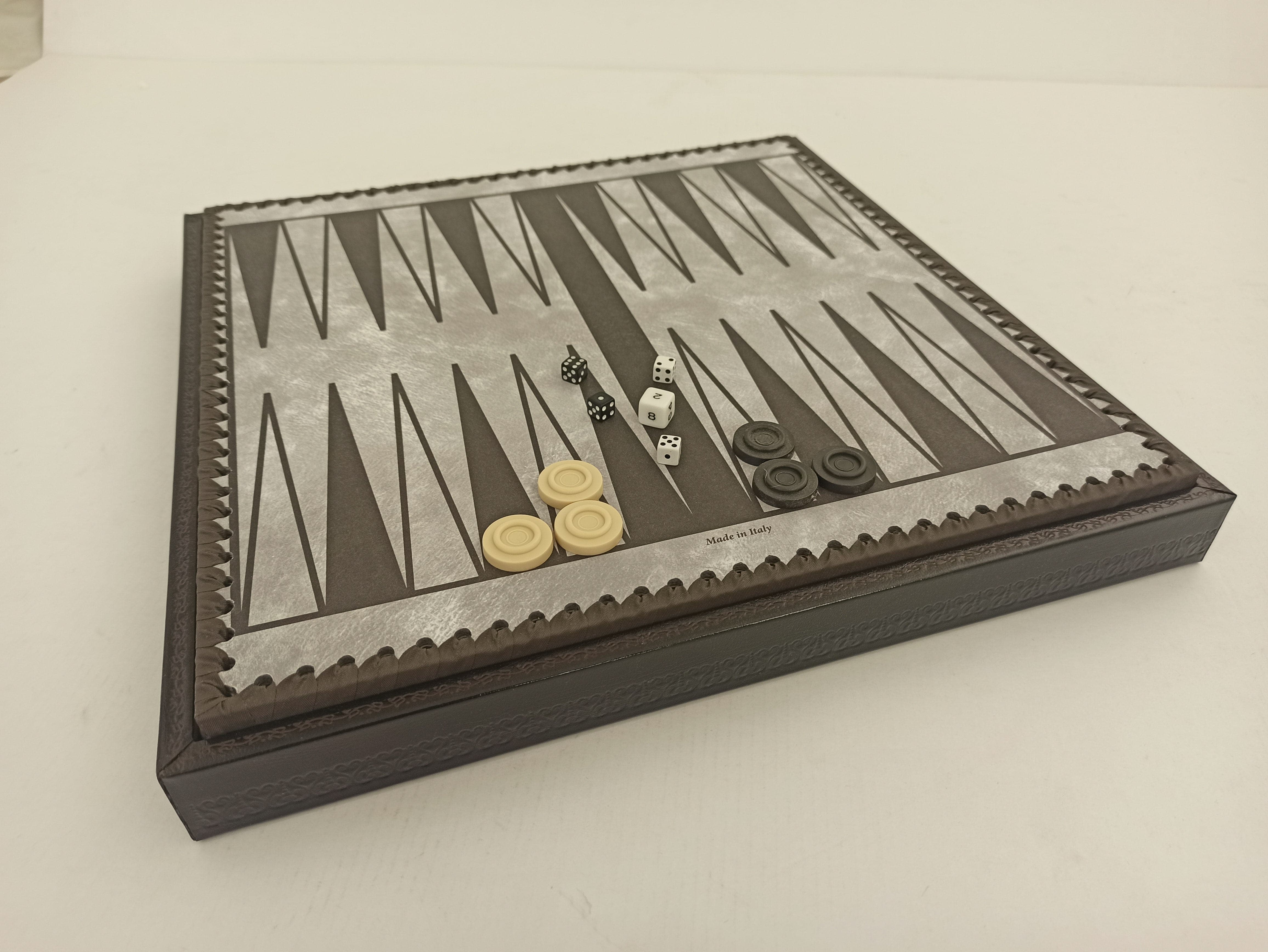 Backgammon board with dice and draughts pieces from The Turin Nero Italian Chess Set.