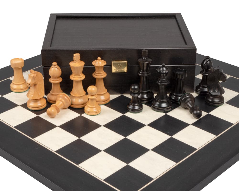 The Down Head Knight and Black Deluxe Chess Set with Case displayed on a chessboard.