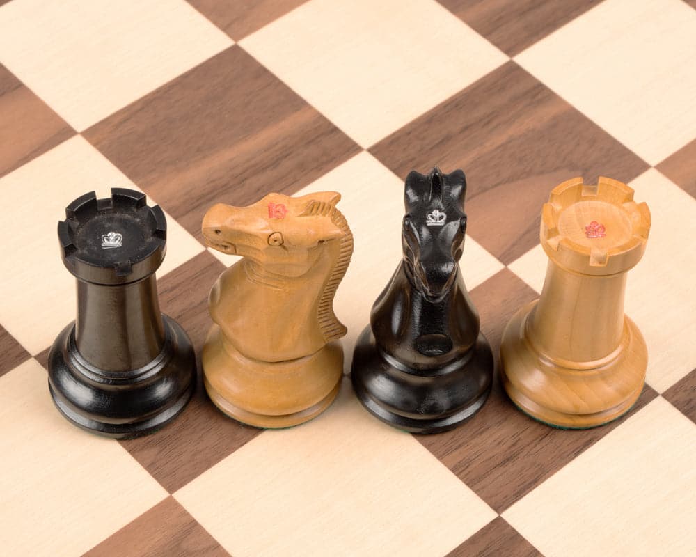 Handcrafted Staunton ebony and walnut chess pieces on deluxe chess board